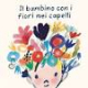 Il bambino con i fiori nei capelli.